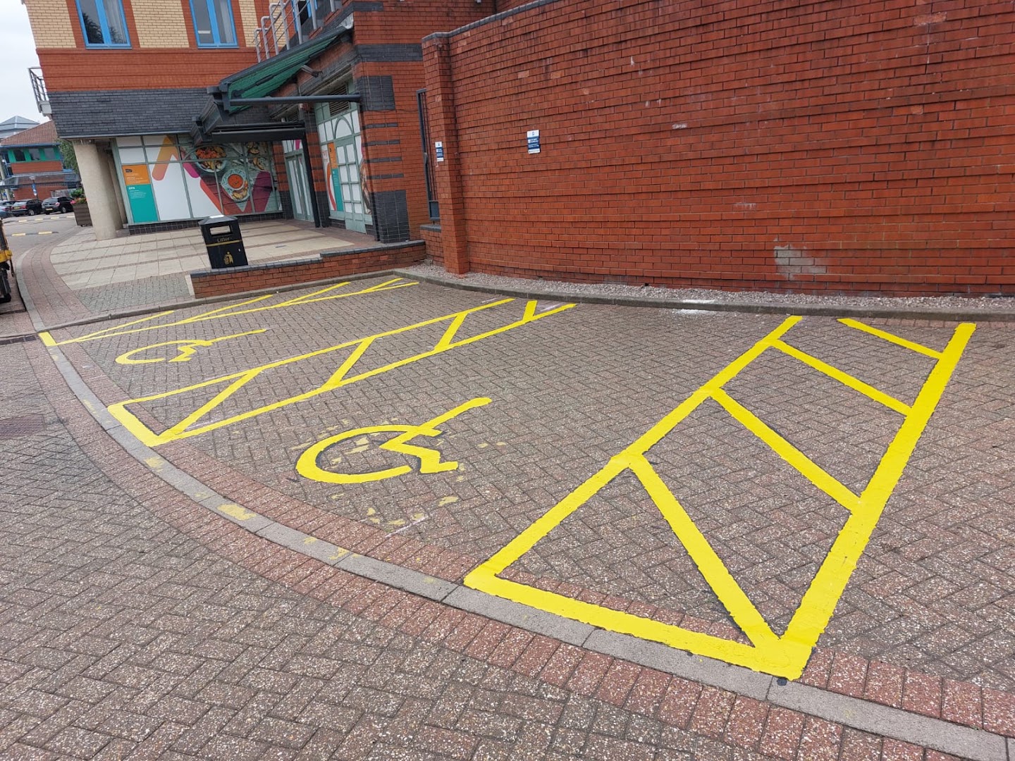 Disabled parking bays marked on block paving